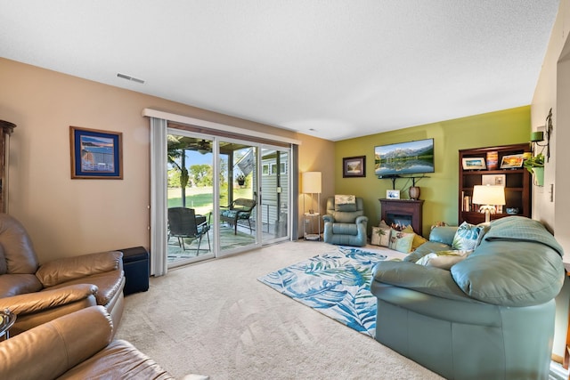 living room featuring visible vents and carpet floors