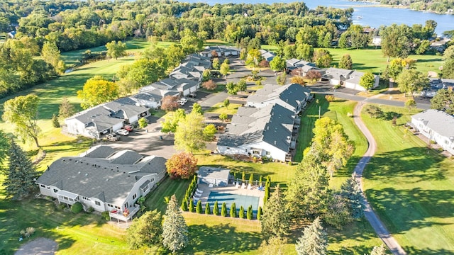 drone / aerial view featuring a residential view and a water view