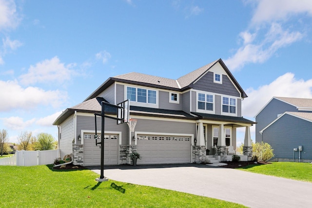 craftsman inspired home with driveway, an attached garage, stone siding, and covered porch