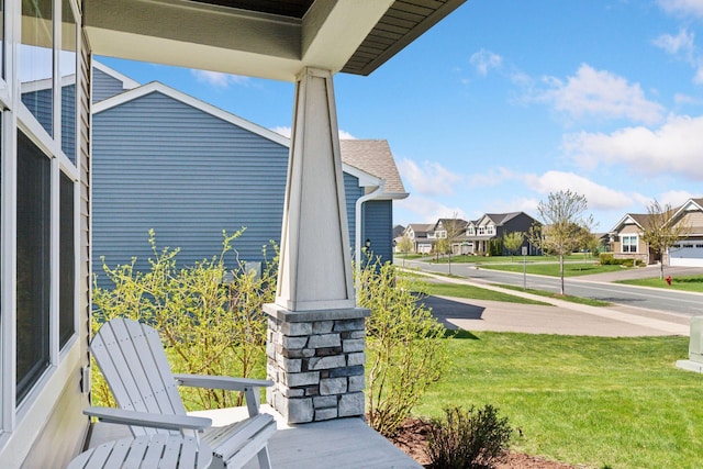 exterior space featuring a residential view and covered porch