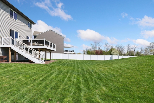 view of yard featuring stairs and a deck