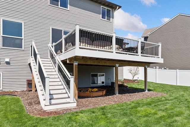 rear view of house with a deck and stairway