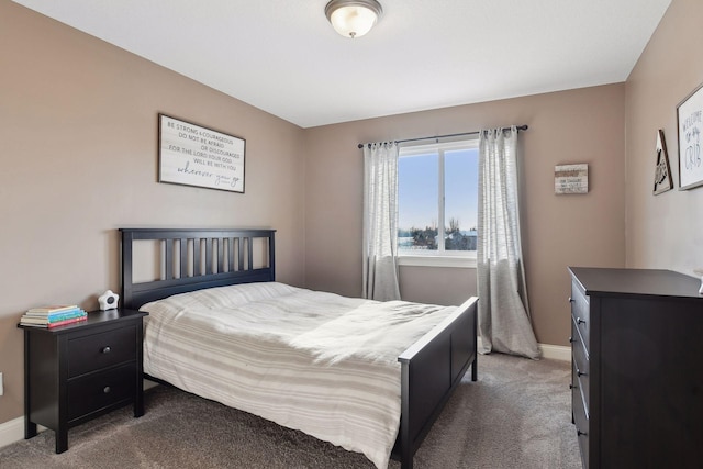 carpeted bedroom with baseboards