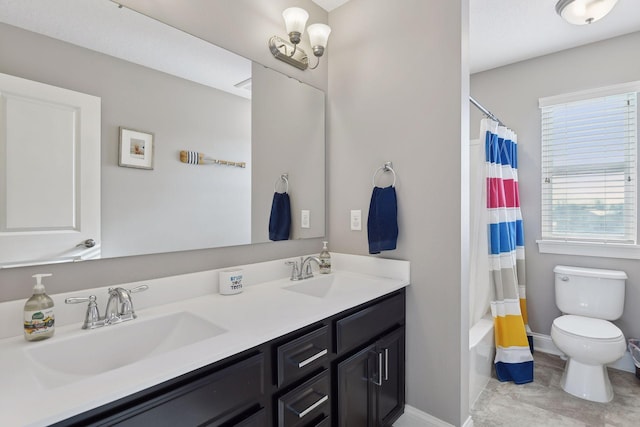 full bathroom with toilet, double vanity, baseboards, and shower / bath combo