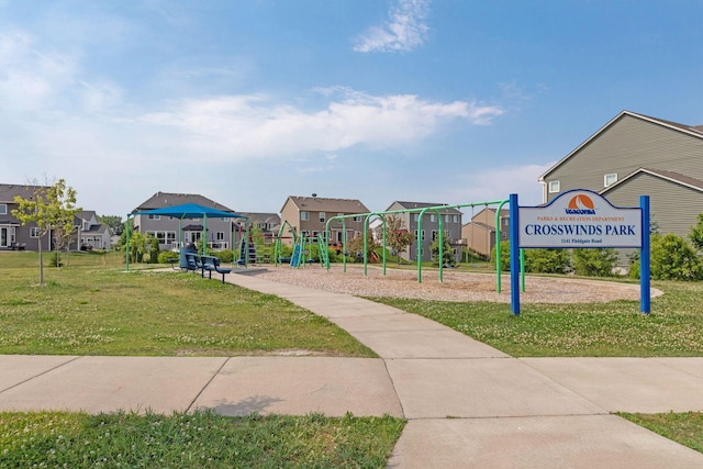 view of home's community with a yard and a residential view