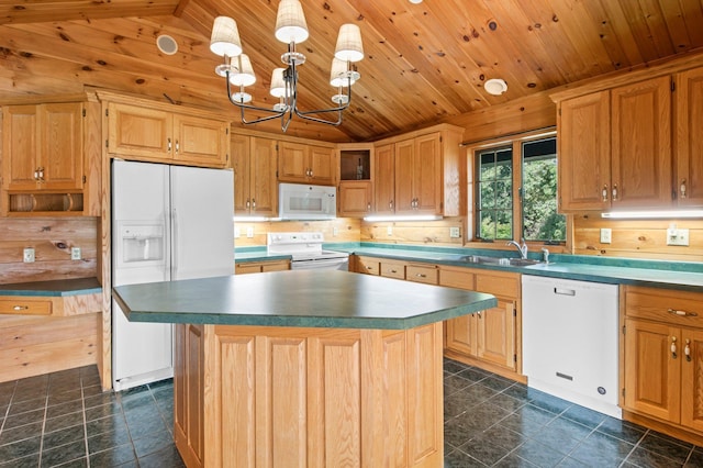 kitchen with a center island, white appliances, a notable chandelier, sink, and lofted ceiling