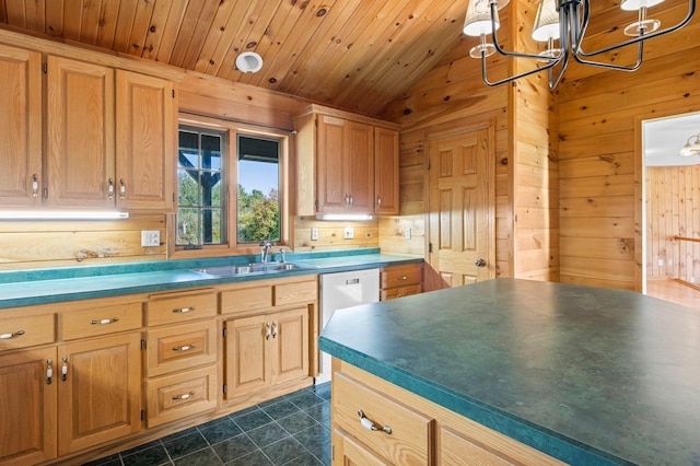 kitchen with vaulted ceiling, dark tile patterned floors, a notable chandelier, sink, and wooden walls