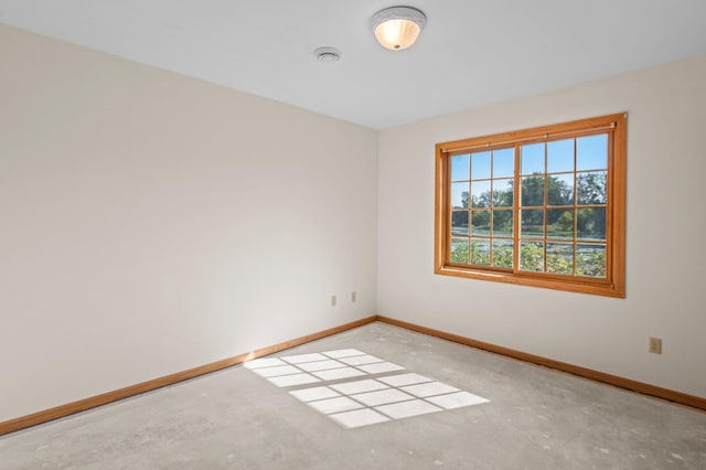 empty room with concrete flooring