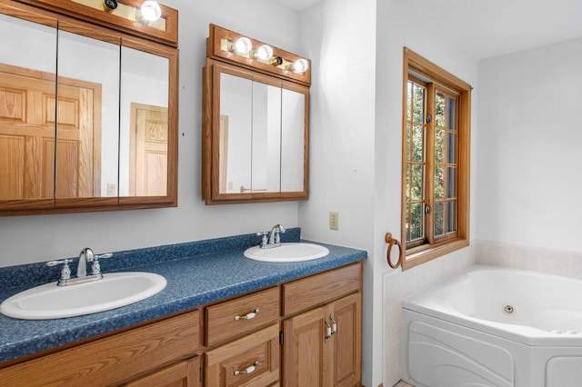 bathroom with vanity and a bath