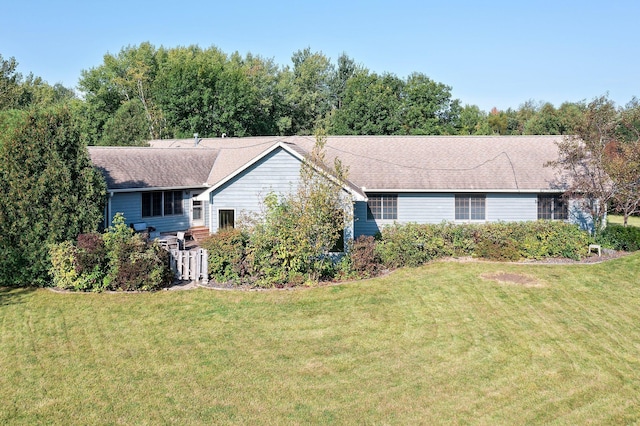 ranch-style home featuring a front yard