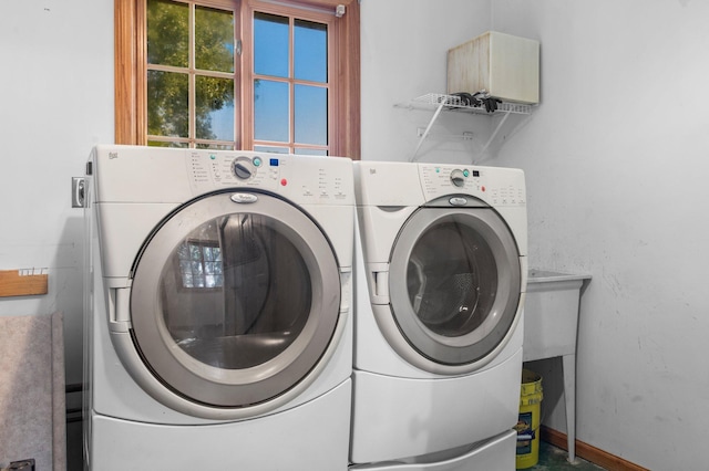 washroom with washer and clothes dryer