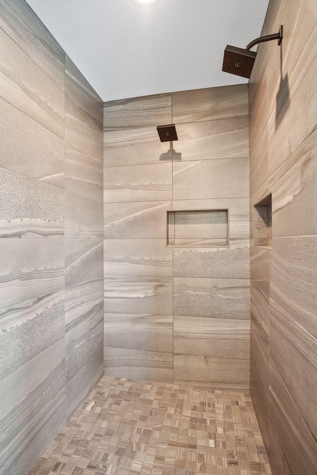 bathroom featuring parquet floors and walk in shower