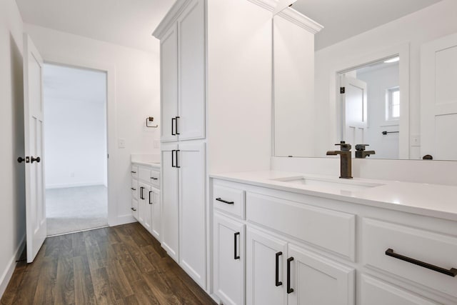 bathroom featuring hardwood / wood-style floors and vanity