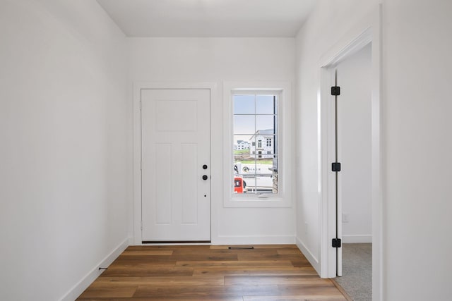 doorway to outside with dark hardwood / wood-style floors