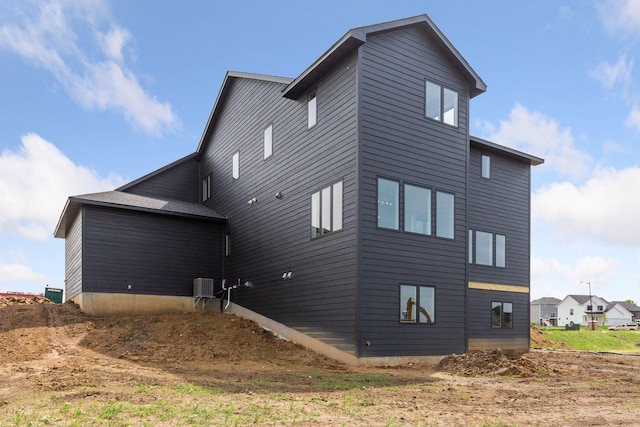 view of side of home with cooling unit