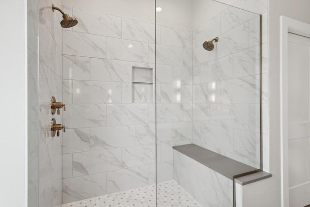 bathroom featuring a tile shower