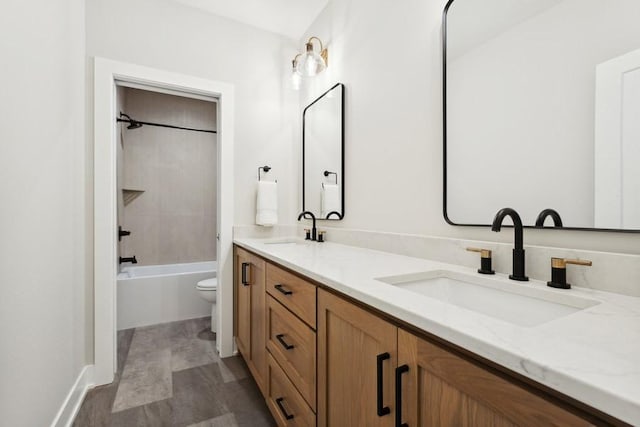 full bathroom with shower / tub combination, vanity, and toilet