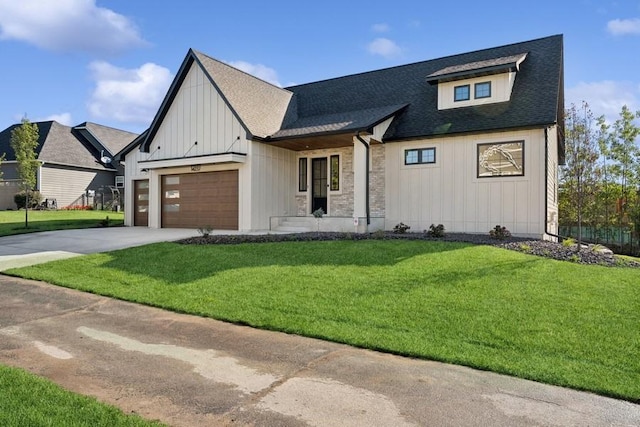 modern farmhouse style home featuring a garage and a front lawn