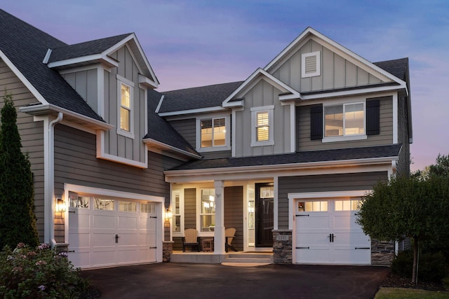 craftsman-style home with a garage and covered porch