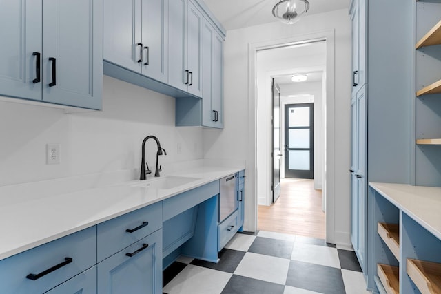 kitchen with sink and light wood-type flooring