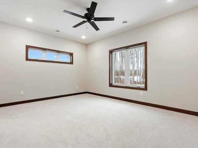 unfurnished room featuring carpet floors and ceiling fan