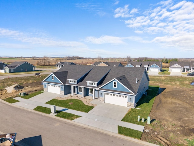 view of front of house featuring a garage and a front lawn