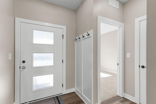 doorway with hardwood / wood-style flooring