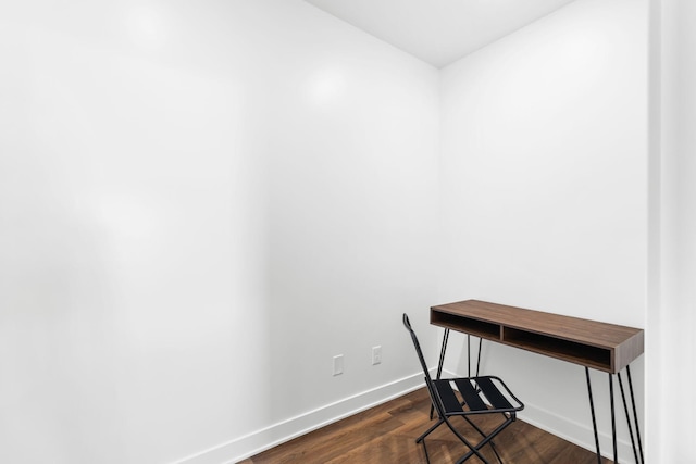 home office with dark hardwood / wood-style flooring