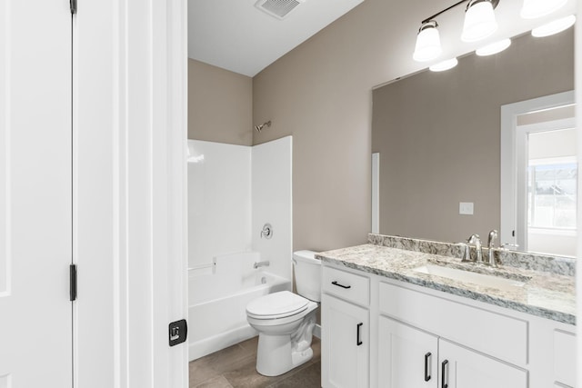 full bathroom with toilet, vanity, tile patterned floors, and shower / bathtub combination