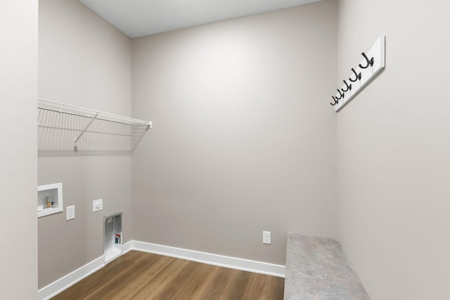 clothes washing area featuring dark wood-type flooring, washer hookup, and hookup for an electric dryer