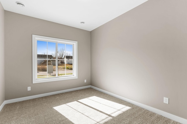 unfurnished room featuring carpet flooring