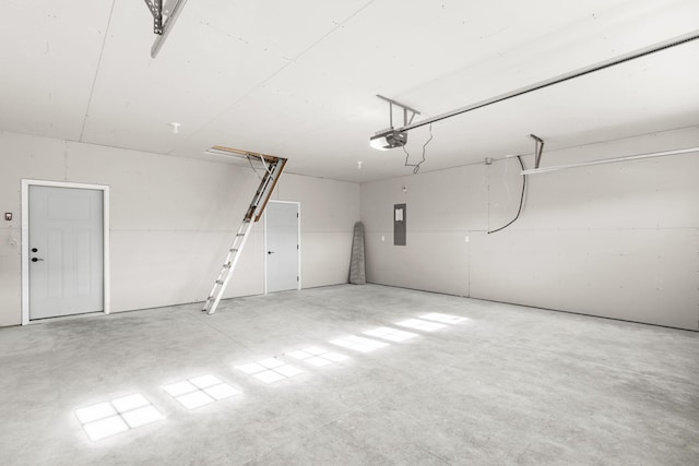 garage featuring a garage door opener and electric panel