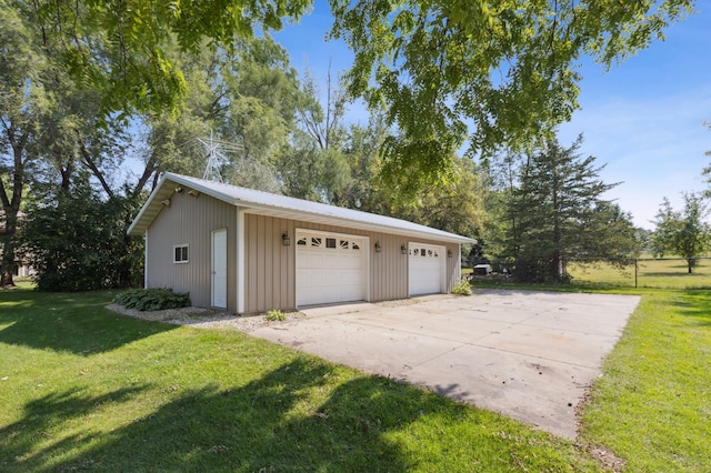 garage featuring a lawn