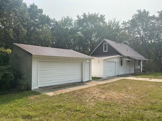 garage featuring a yard