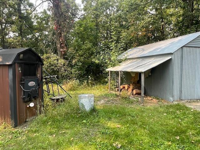 view of outbuilding with a lawn