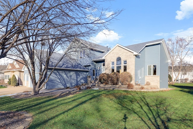 view of front of property with a front lawn and a garage