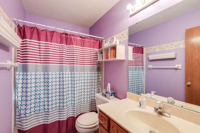 bathroom featuring vanity, a textured ceiling, toilet, and curtained shower