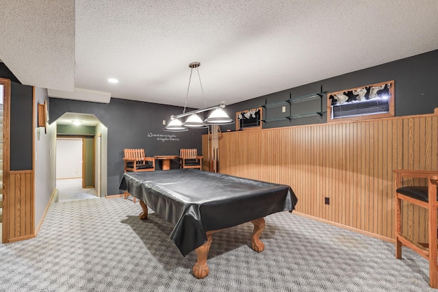 playroom with carpet flooring, wooden walls, and billiards