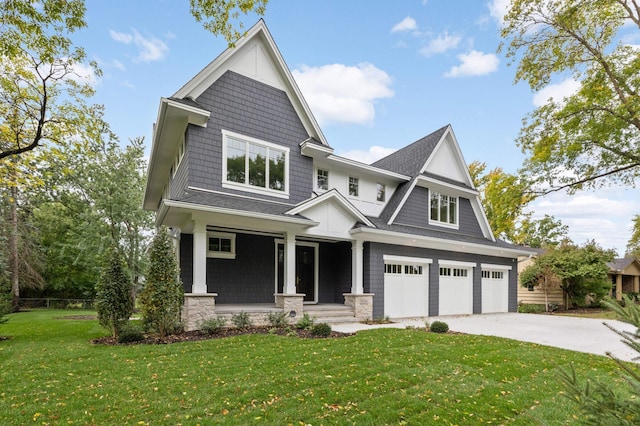 craftsman-style house with a front yard, a garage, and covered porch