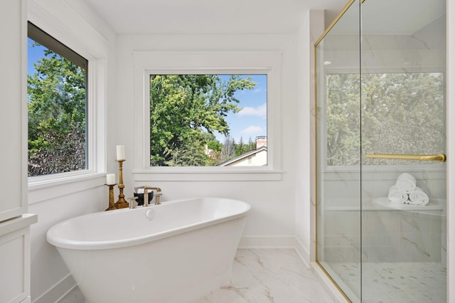 bathroom with shower with separate bathtub and a wealth of natural light