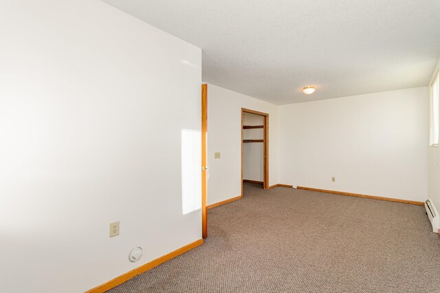 spare room featuring light carpet