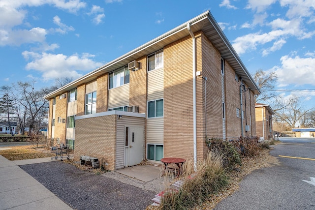 exterior space with an AC wall unit