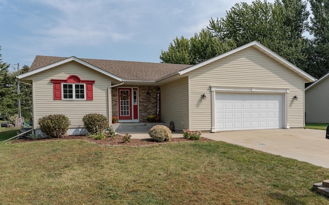 ranch-style house featuring a garage and a front yard