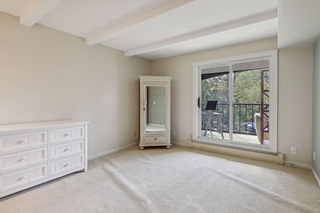 unfurnished bedroom with beamed ceiling, access to exterior, and light colored carpet