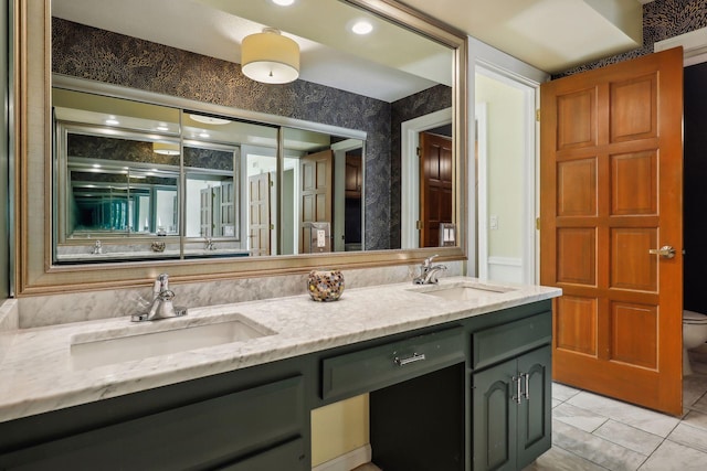 bathroom featuring tile patterned flooring, toilet, and vanity