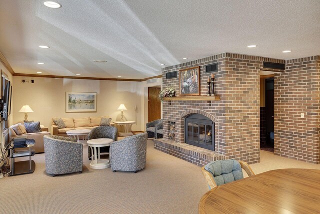 living room with ornamental molding, light carpet, a textured ceiling, and a brick fireplace