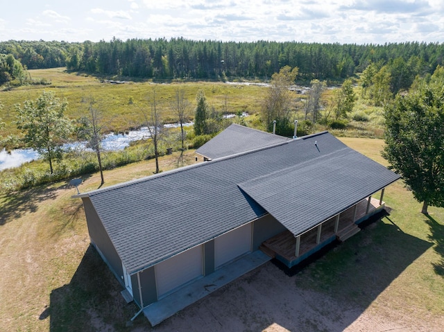 bird's eye view featuring a forest view