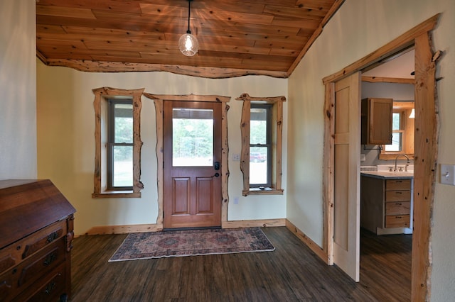 entryway with lofted ceiling, dark wood-style flooring, wooden ceiling, and baseboards