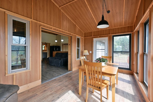 sunroom featuring wooden ceiling and vaulted ceiling