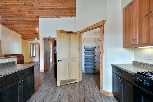 kitchen featuring lofted ceiling, wooden ceiling, wood finished floors, baseboards, and range with gas cooktop